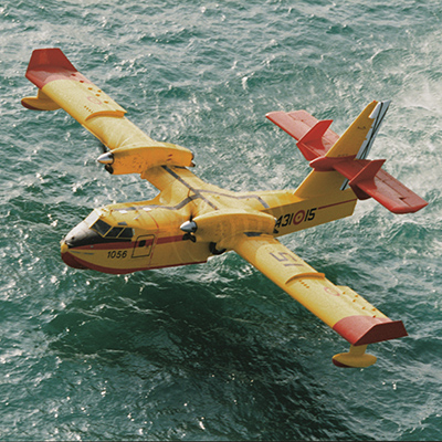 Aerial firefighter flying low over the water