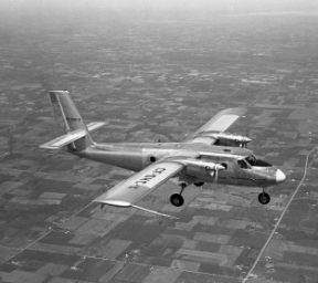 Black-and-white image of Twin Otter in flight