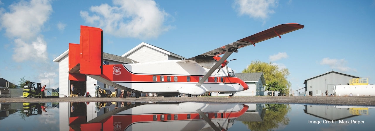 A Skyvan aircraft landed by the water